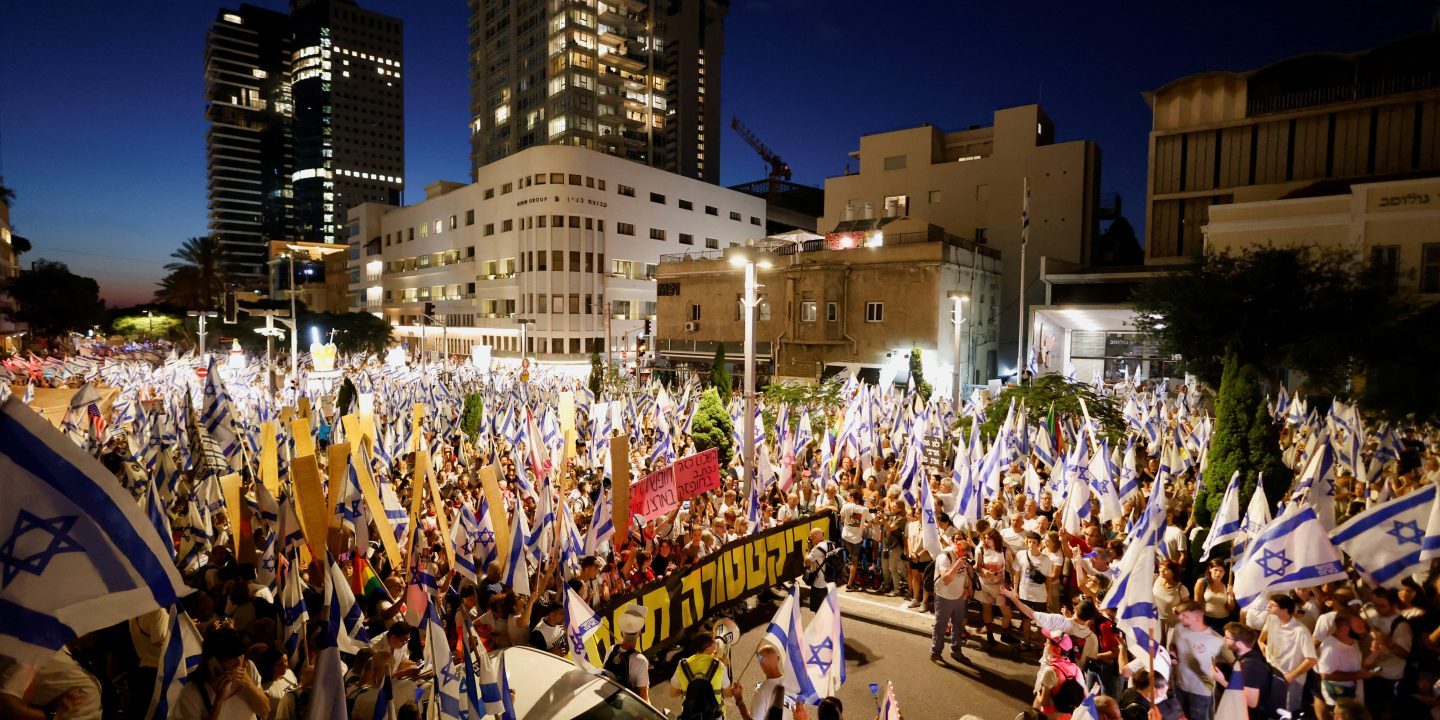 Thousands Protest in Tel Aviv Against Netanyahu’s Government Policies as Prime Minister Heads to USA